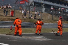Marshals clear the track