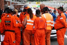Marshals in the pit lane