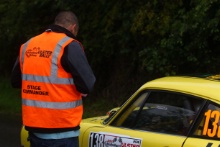 A marshal at the start of a stage