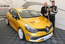 Mike Robinson receives his championship Trophy for winning the Michelin Clio Cup series from Jeremy Townsend of Renault UK