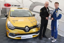 Anton Spires  receives his championship Trophy for winning the Michelin Clio Cup series from Jeremy Townsend of Renault UK