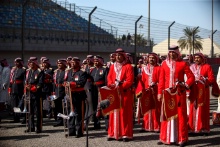A band perform the Bahrain national anthem
