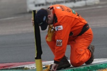 A marshal repacing a floppy cone