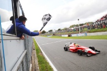 Sam Roach waving the Chquered Flag on the final F4 race