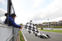 Sam Roach waving the Chquered Flag on the final F4 race