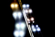 The GT Cars enter the pits during a night time caution