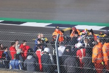 Marshals clean the track after a fire