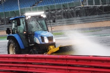 A tracetor cleaning the Track 
